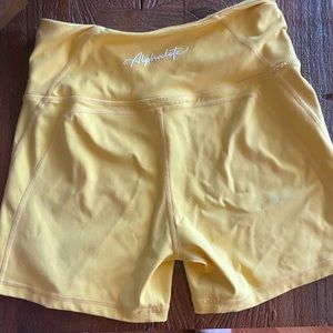 Alphalete surge shorts yellow